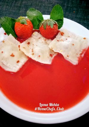 A picture of Dry Fruits Ravioli with Strawberry sauce.
