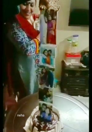 A picture of Picture pulling  chocolate cake.