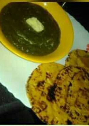 A picture of Sarso ka saag with makke ki roti.