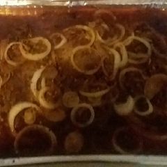A picture of Steak and onions.