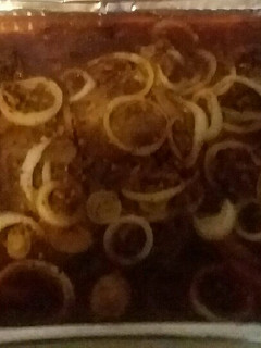 A picture of Steak and onions.