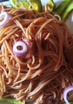 A picture of Spaghetti with smoked chicken sausage and avocado.