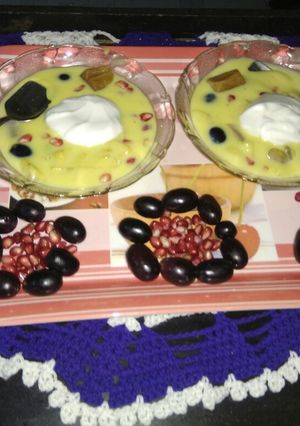 A picture of Fruit custard with icecream.