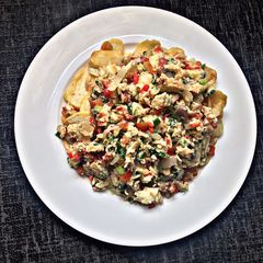 A picture of Spring onion scrambled eggs with fries.