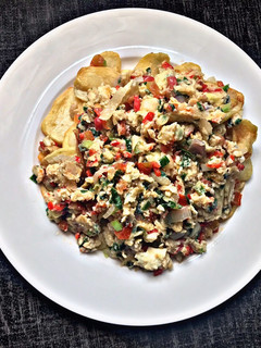 A picture of Spring onion scrambled eggs with fries.