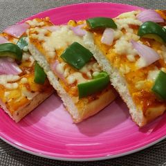 A picture of Pizza paratha full with capsicum & cheese.