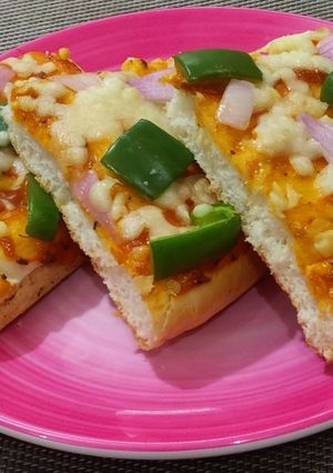 A picture of Pizza paratha full with capsicum & cheese.