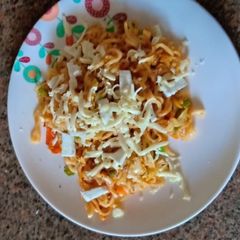 Cheesy schezwan Maggi A picture of Cheesy schezwan Maggi.