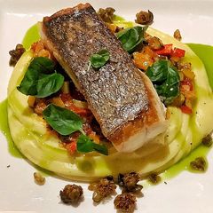 A picture of Blue eye cod with caponata, Dutch creme mash, fried capers and served with basil and lemon oil.