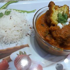A picture of Bottle gourd kaju kofta curry with jeera rice.
