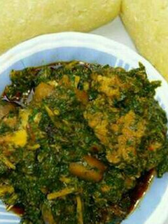 A picture of Afang soup and eba.