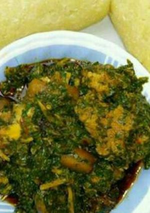 A picture of Afang soup and eba.