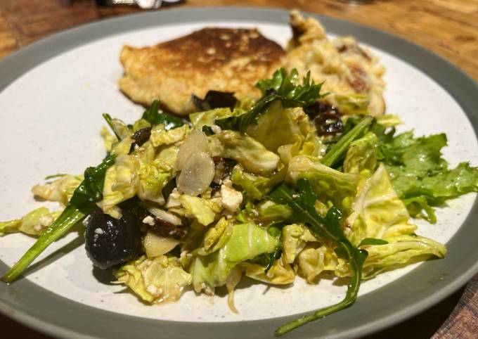 Savoy cabbage and green leaves salad with tasty dressing