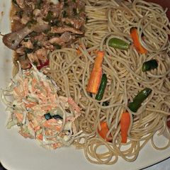 A picture of Spaghetti and chicken sauce.