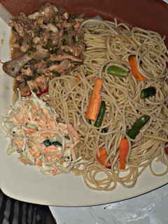 A picture of Spaghetti and chicken sauce.