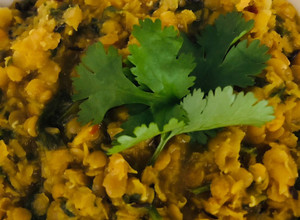 A picture of Carrot top and red lentil dal - vegan.