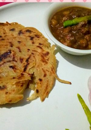 A picture of Amritsari chole with lacha paratha.