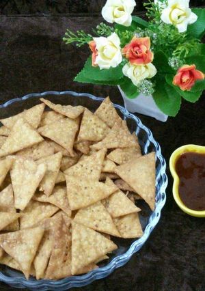 A picture of Spicy crispy mexican nachos in desi style with mix lentils.