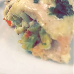 A picture of Chicken filled with avocado.