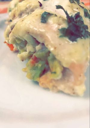 A picture of Chicken filled with avocado.