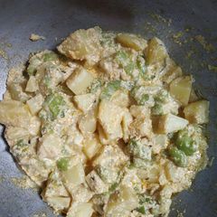 A picture of Poppy seeds curry with potato and ridge gourd.