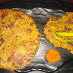 A picture of Winter special Digestive Dhebri with leafy greens.
