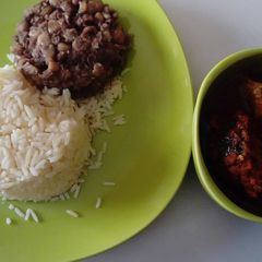 A picture of Croker Fish Stew with white Rice and Beans.