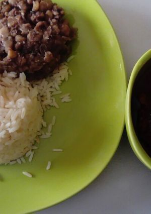 A picture of Croker Fish Stew with white Rice and Beans.