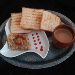 Yummy egg masala omelette with grilled toast A picture of Yummy egg masala omelette with grilled toast.