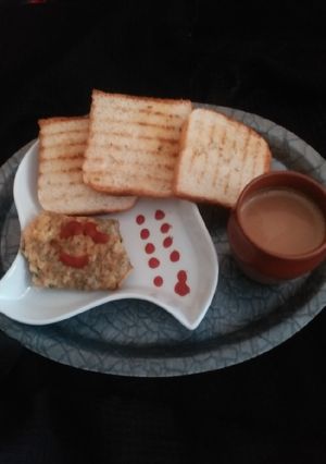 A picture of Yummy egg masala omelette with grilled toast.