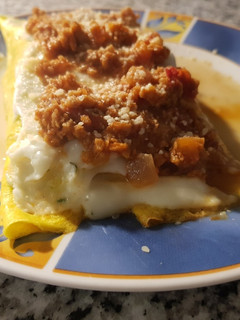 Una foto de Canelones de espinaca y nabo con salsa boloñesa vegetariana