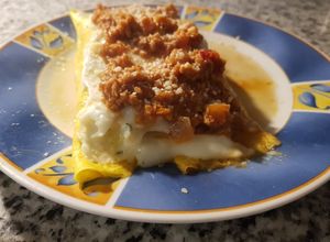 Una foto de Canelones de espinaca y nabo con salsa boloñesa vegetariana
