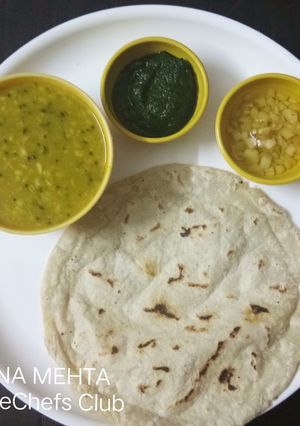 A picture of Urad daal with Jowar roti.