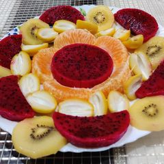 A picture of Fruit Salad with Drizzled Dressing.