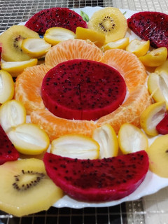 A picture of Fruit Salad with Drizzled Dressing.