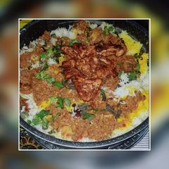 A picture of Qeema gravy with chicken sajji rice.