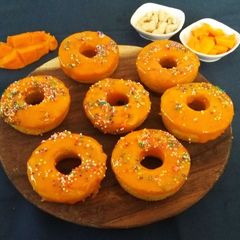 A picture of Baked Mango Doughnuts with Mango Glaze.