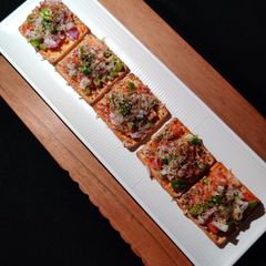 A picture of Cream cracker pizza bites.