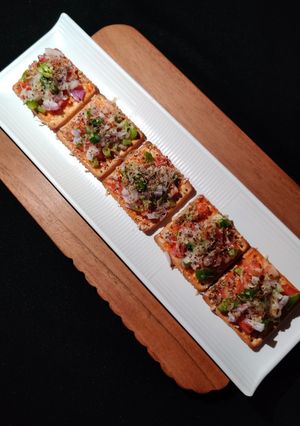 A picture of Cream cracker pizza bites.