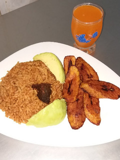 A picture of Jollof Rice and Fried beef.