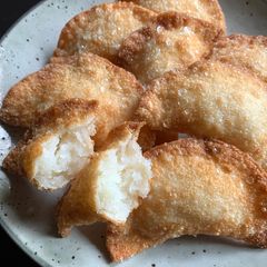 A picture of Fried Gyoza Wrapper Snack with Sweet Coconut Filling.