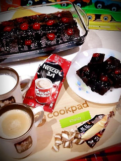 A picture of Brownies with coffee.