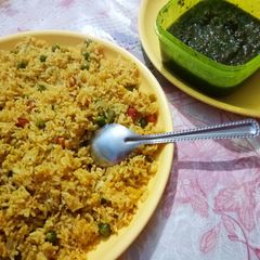 A picture of Fried rice with pudhina chutney.