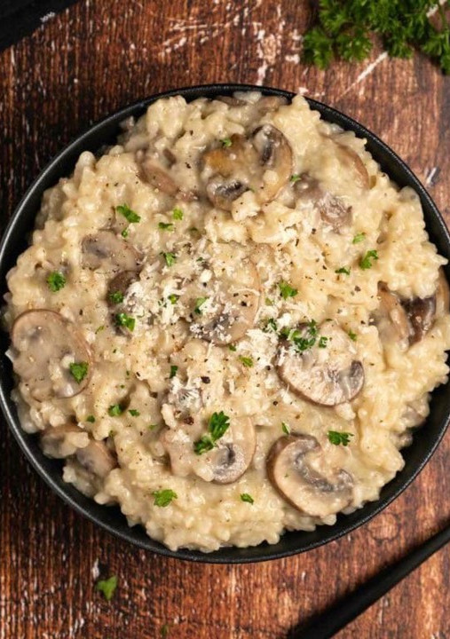 Una foto de Risotto de champiñones y pollo