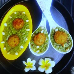 A picture of Peanuts Stuffed Banana Appe in Spinach Sabudana Pudding.
