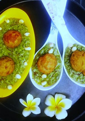 A picture of Peanuts Stuffed Banana Appe in Spinach Sabudana Pudding.