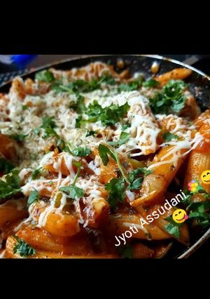 A picture of Pink pasta with sauce.