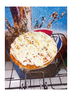 A picture of Double Cheese Margherita Pizza🍕🍕🍕.