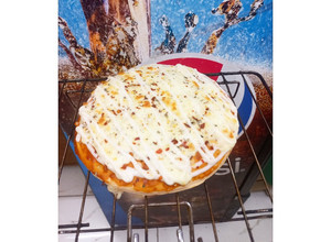 A picture of Double Cheese Margherita Pizza🍕🍕🍕.