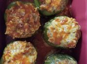 A picture of sausage stuffed bell peppers